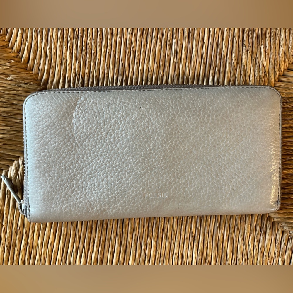 Fossil Leather zip around wallet with pink lining card slots and coin section